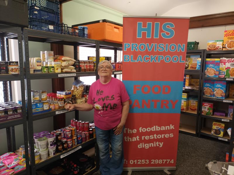 Director Chris Philips in the HIS Provision food pantry