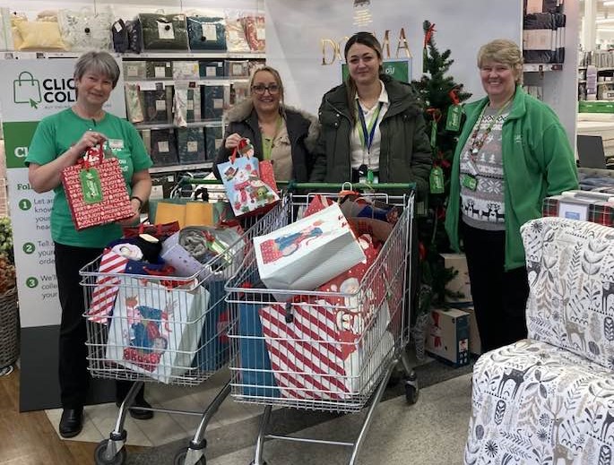 IPP staff collect the gifts from the Blackburn Dunelm store